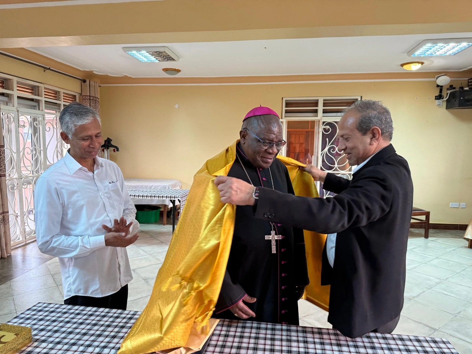 Superior General Br.John Kallarackal Felicitating Rev. Paul Ssemogere of the Archdiocese of Kampala